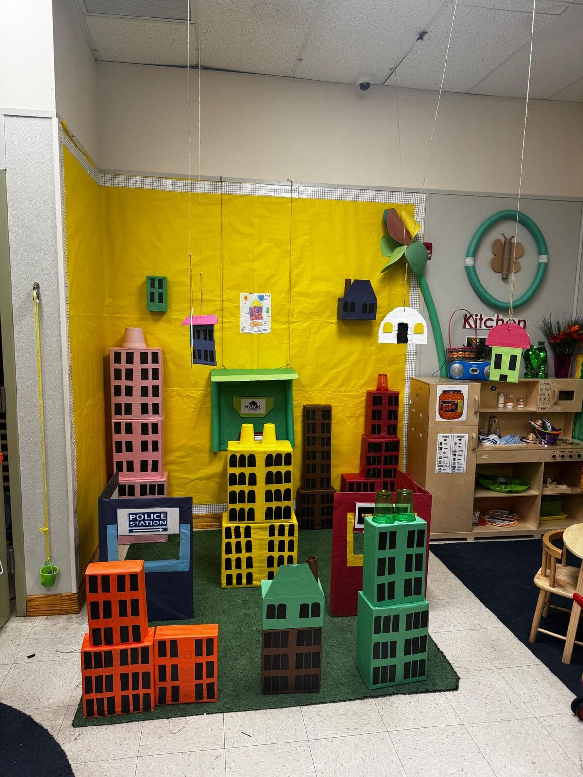 A colorful cityscape built by children as a classroom art and building project