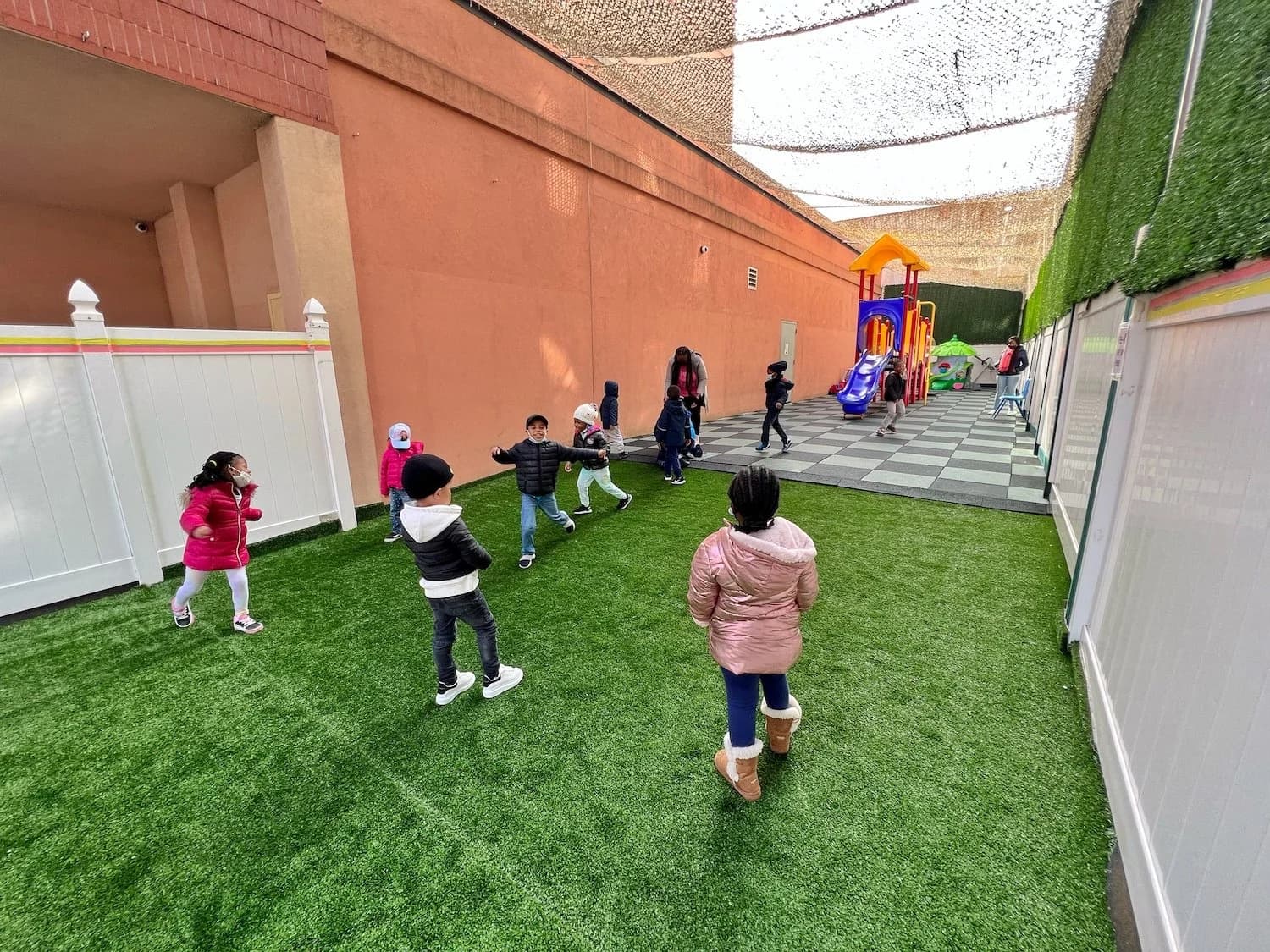 Children doing a guided stretching exercise outdoors