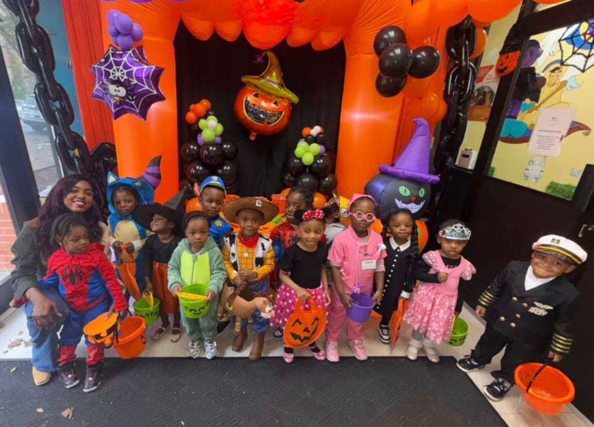 Twos program children in Halloween costumes at Einstein Daycare