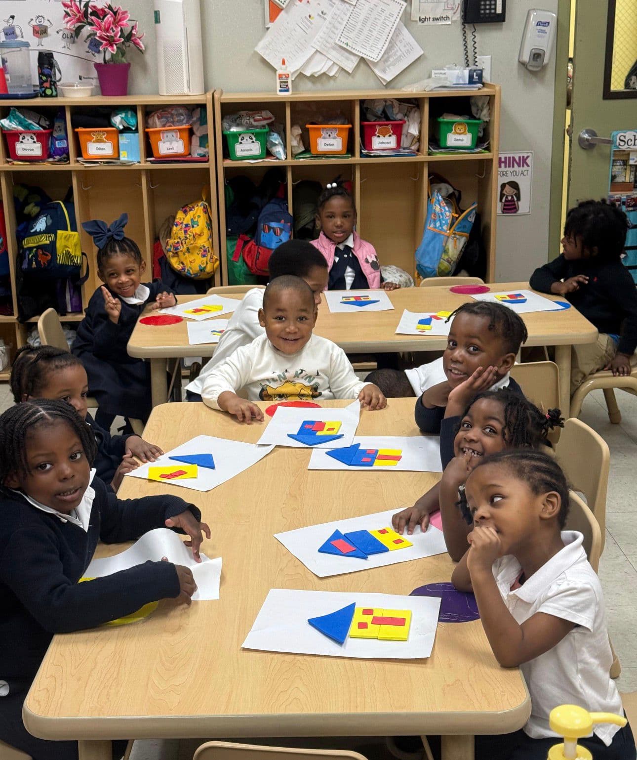 Children working on a shapes and geometry learning activity at Einstein Daycare