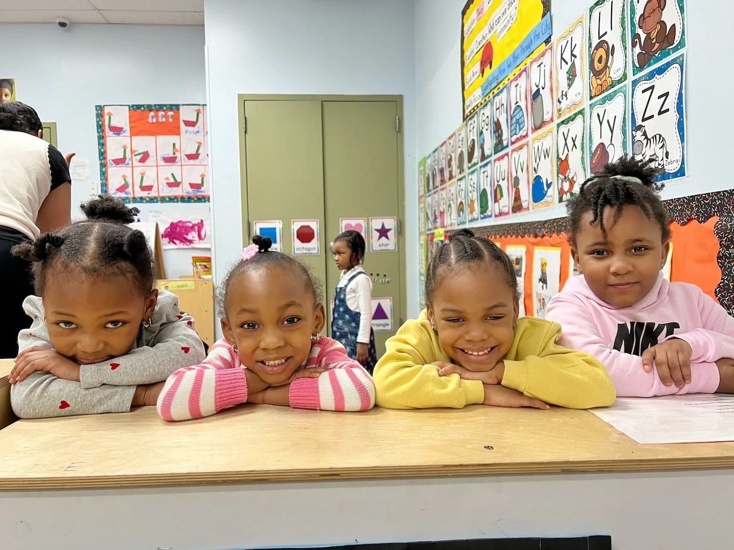 Children smiling together at Einstein Daycare supporting social-emotional development in East Flatbush Brooklyn 11212