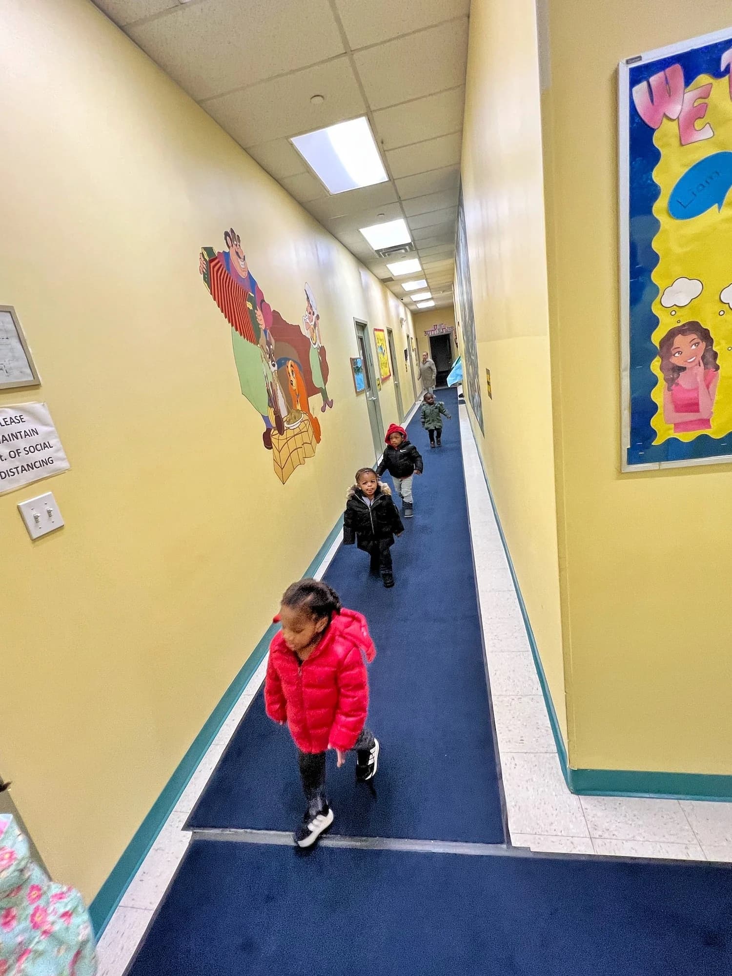 Children walking through hallway at a licensed daycare in East Flatbush Brooklyn